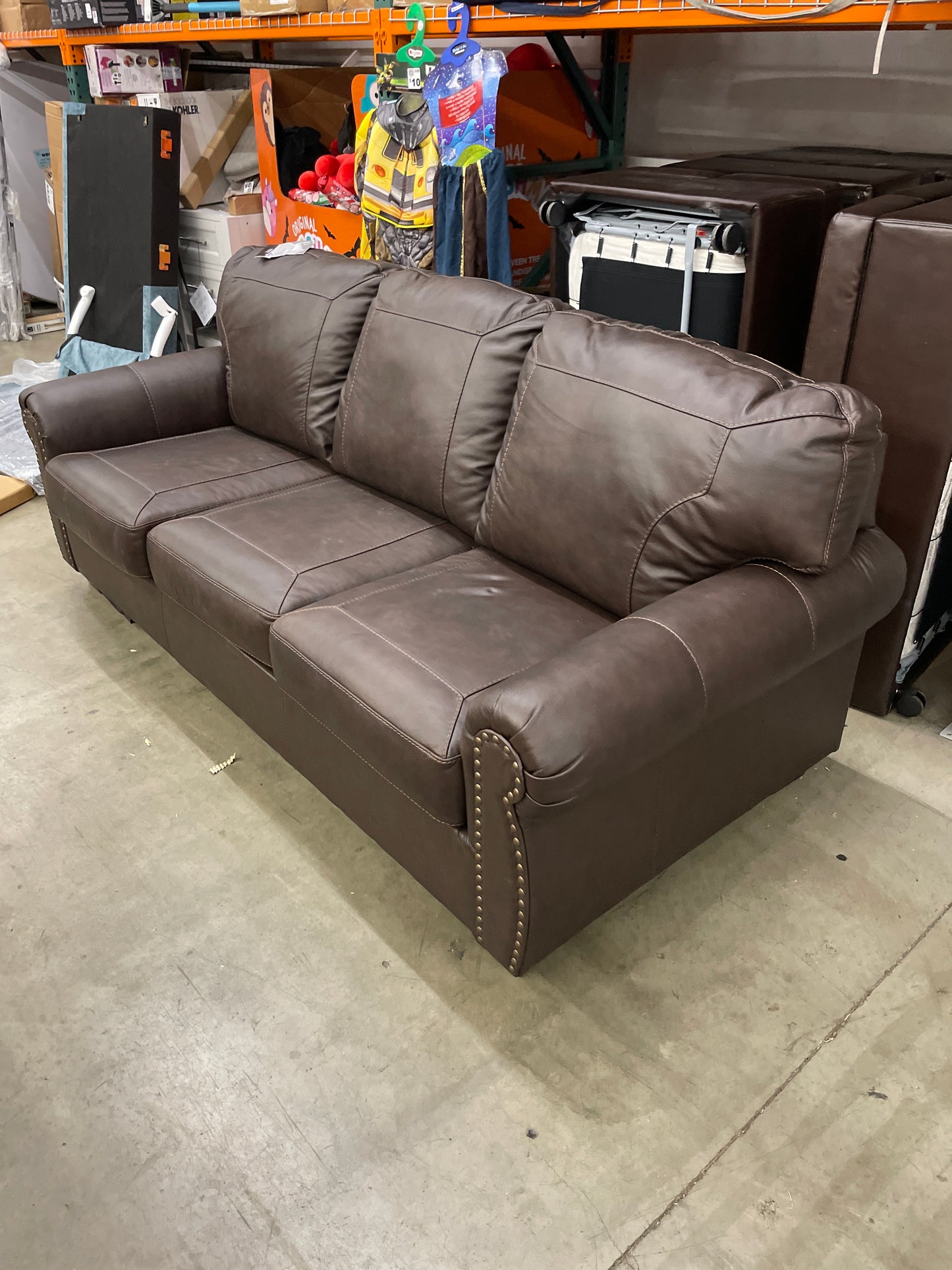 Signature Design by Ashley Colleton Classic Leather Match Sofa with Nailheads, Dark Brown - Retail $1057