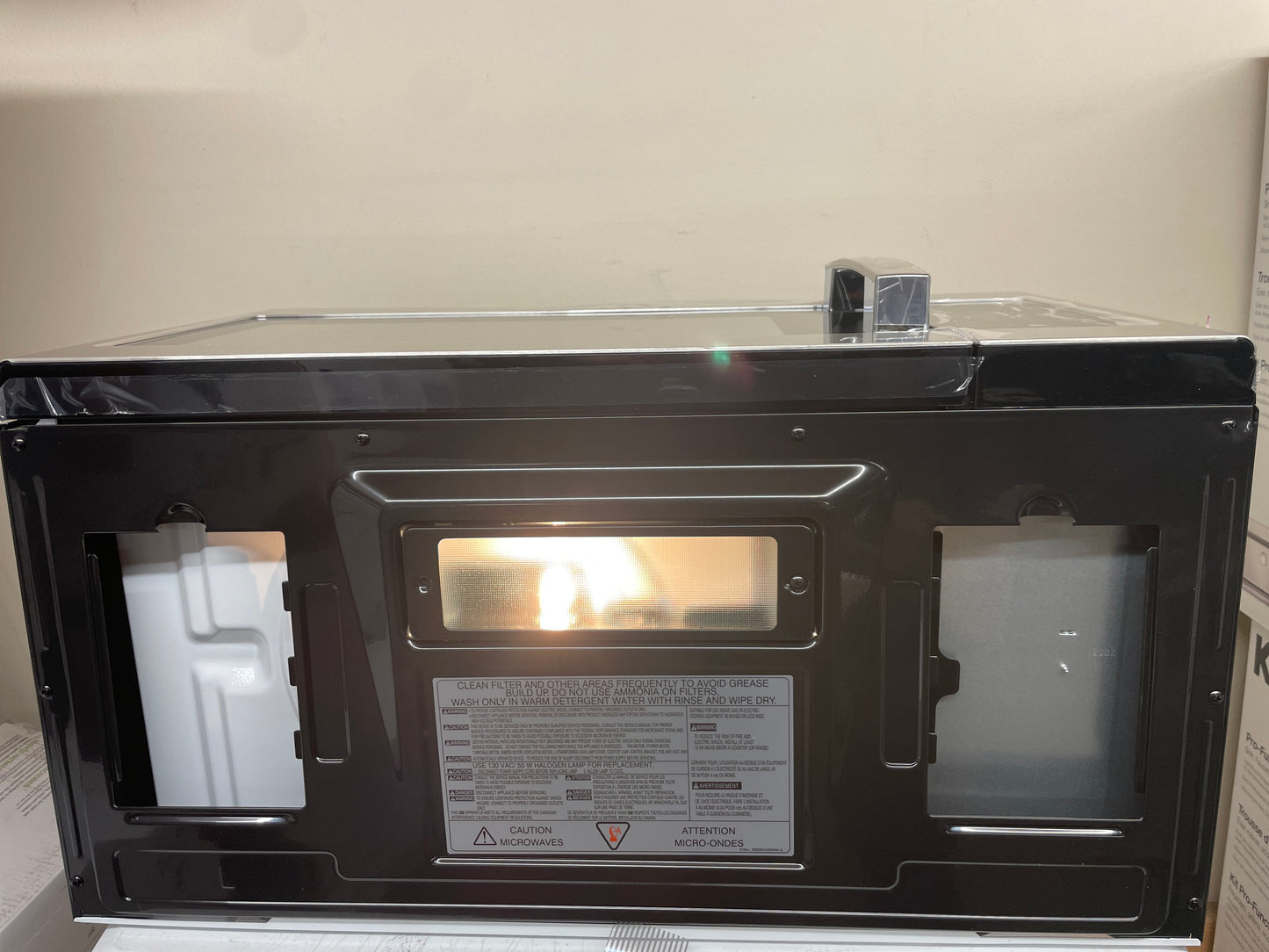 GE 1.6 cu. ft. Over-the-Range Microwave Oven with Cooktop Lighting and 300-CFM Exhaust Fan JVM3160RFSS - Retail $359