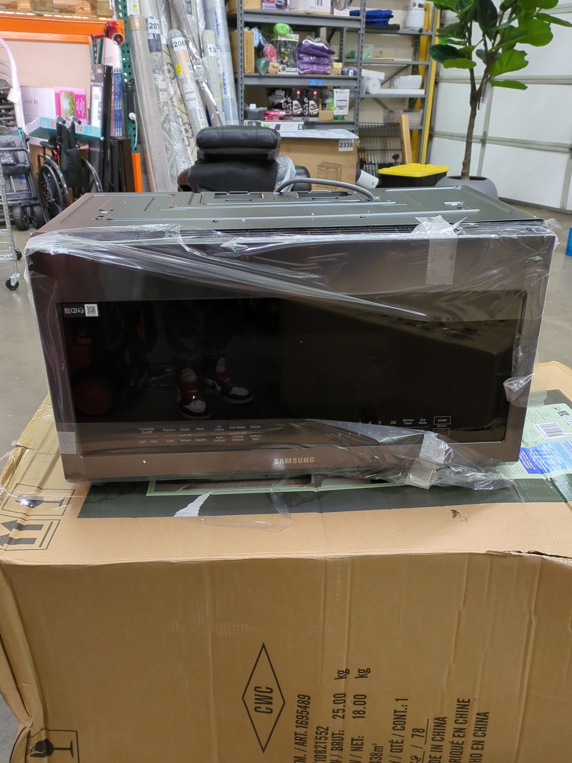 Samsung 2.1 cu. ft. Over-the-Range Microwave with Sensor Cook ME21M706BAG - Retail $479