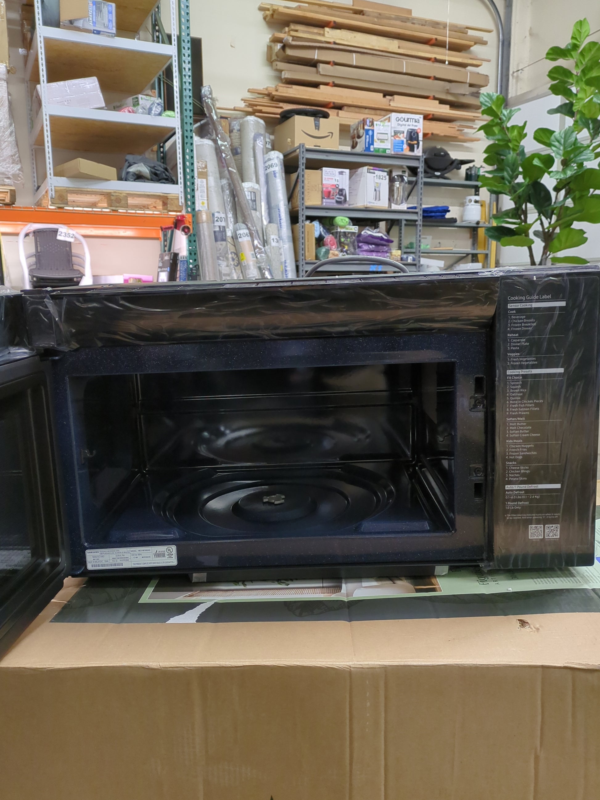 Samsung 2.1 cu. ft. Over-the-Range Microwave with Sensor Cook ME21M706BAG - Retail $479