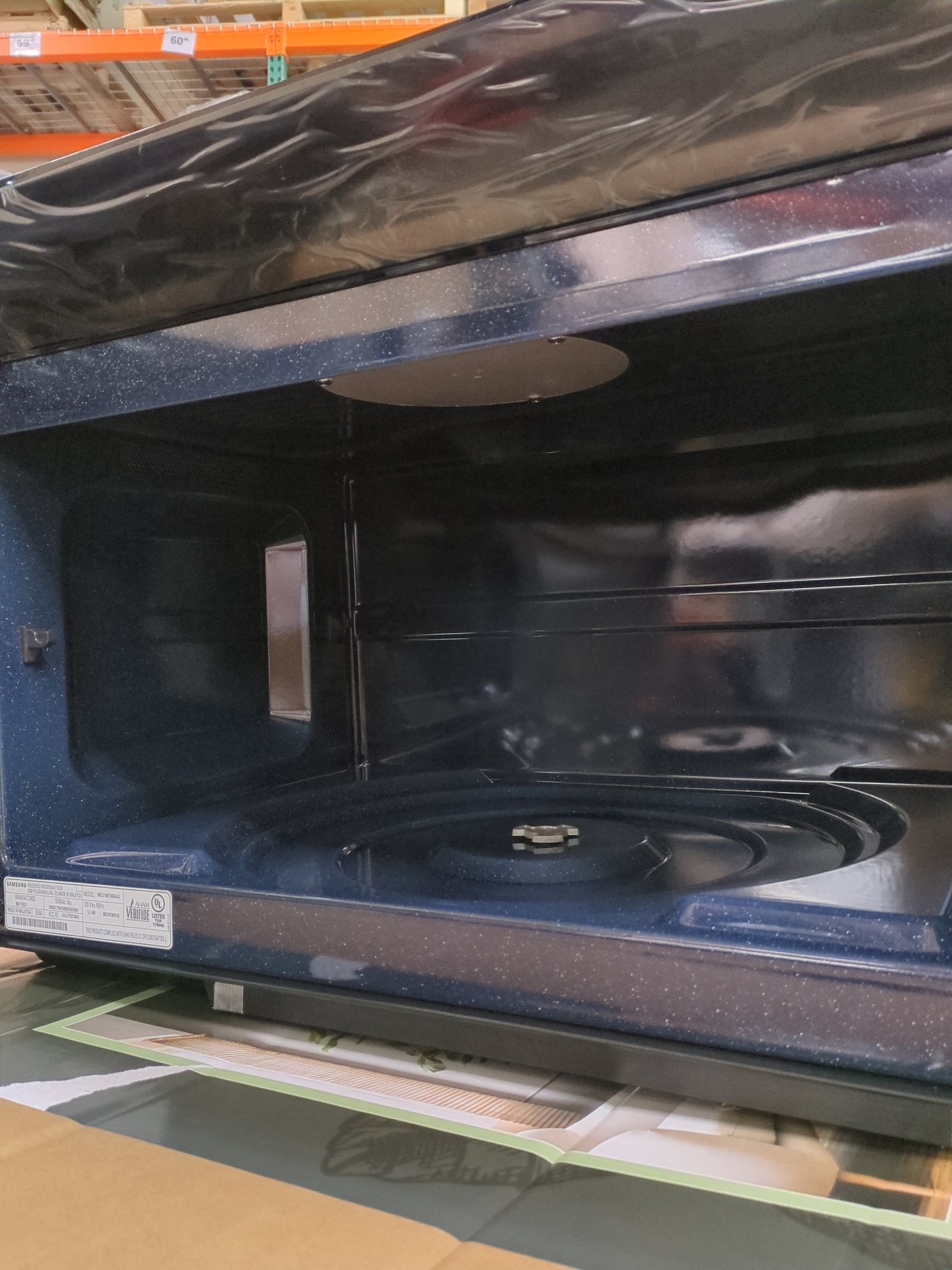 Samsung 2.1 cu. ft. Over-the-Range Microwave with Sensor Cook ME21M706BAG - Retail $479