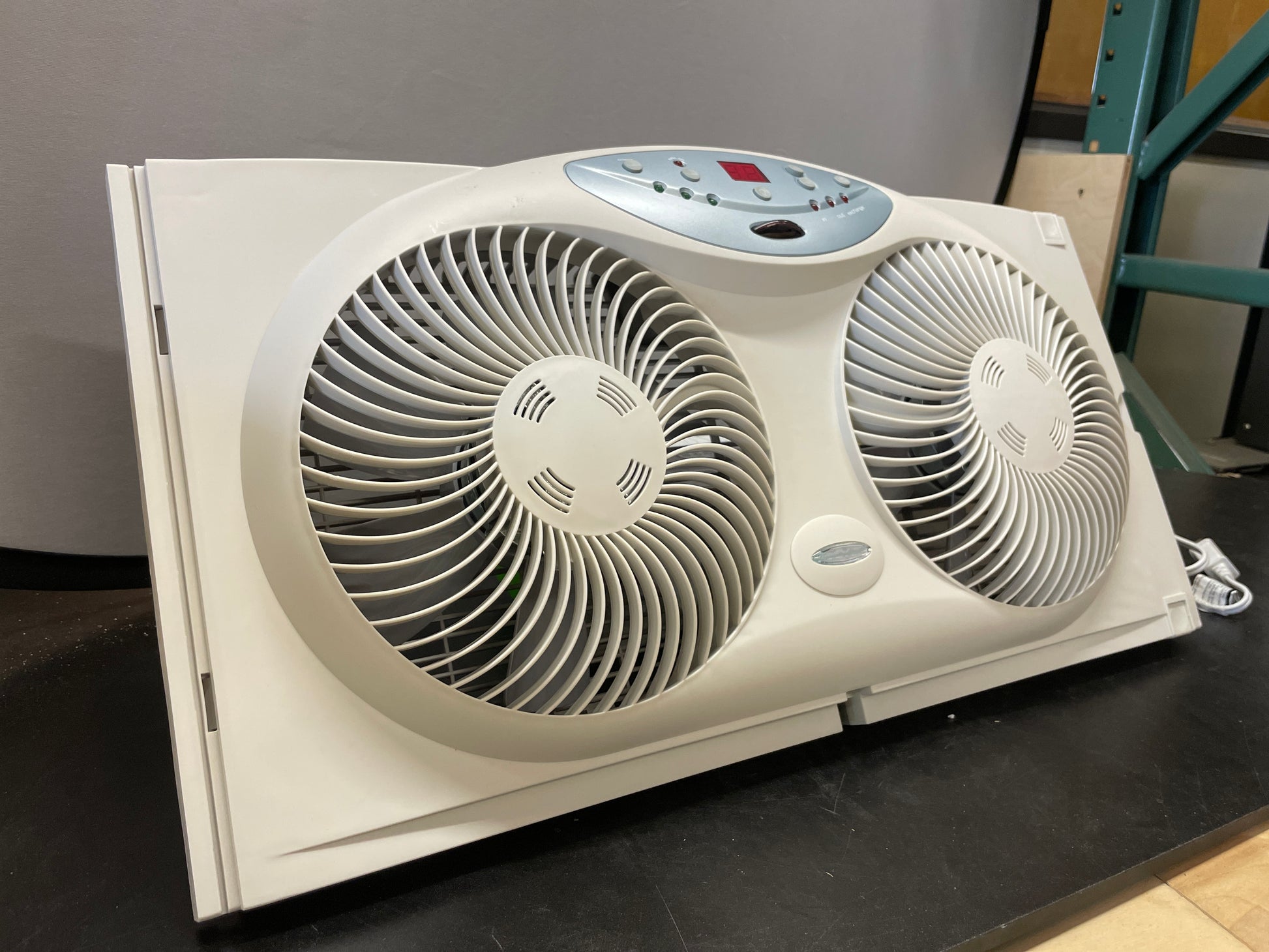 BIONAIRE Premium Digital 8.5" Twin Window Fan, Reversible Airflow Control, Exhaust and Intake, 3 Speeds, Extender Panels, Programmable Thermostat, LED Temperature Display, Remote Control, Light Grey - Retail $55