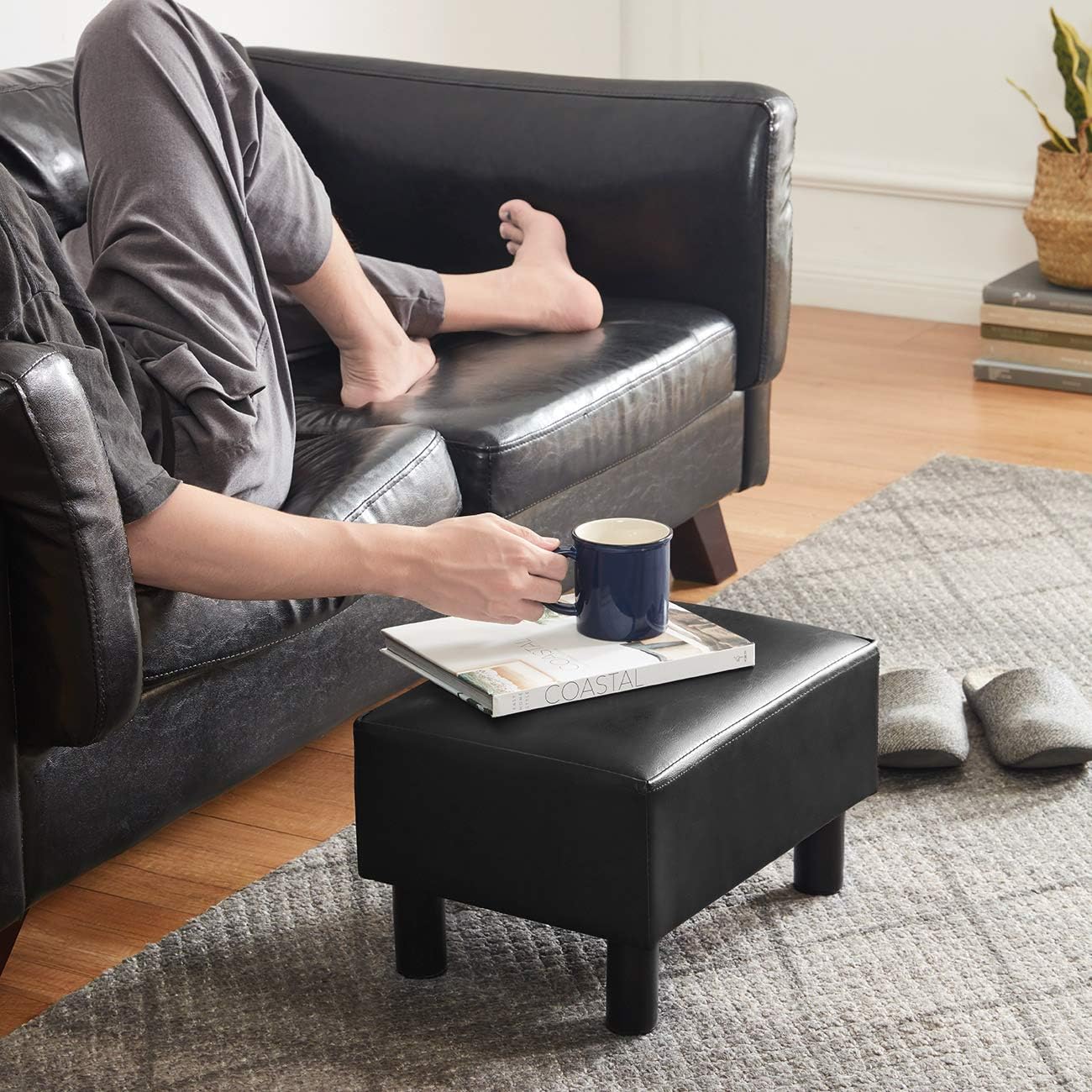 NEW - 16 inches Footstool Ottoman with 4 Stable Wooden Legs, Small Under Desk Footrest, Black PU Faux Leather Step Stool with Padded Seat for Living Room Bedroom - Retail $35