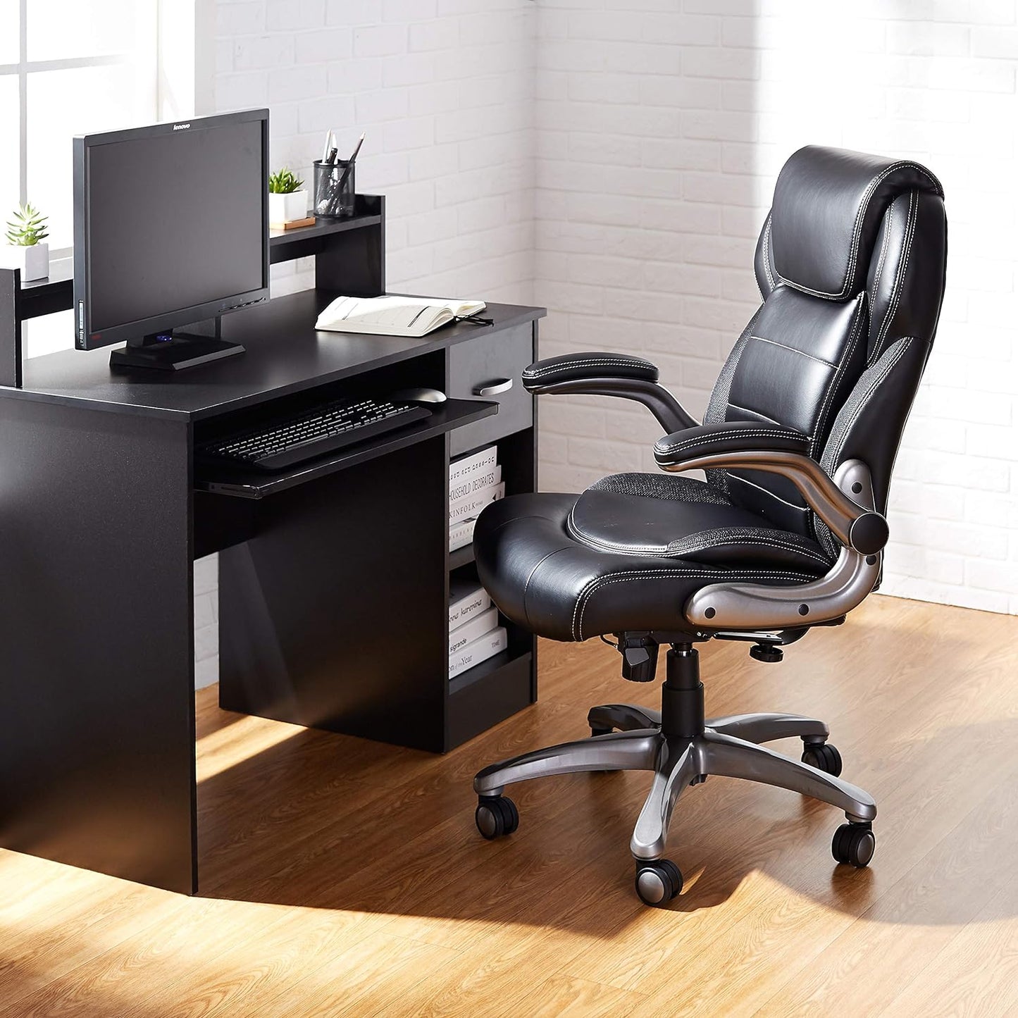 NEW - Amazon Basics Ergonomic High-Back Bonded Leather Executive Chair with Flip-Up Arms and Lumbar Support, Black (Previously Amazon Commercial brand) - Retail $189