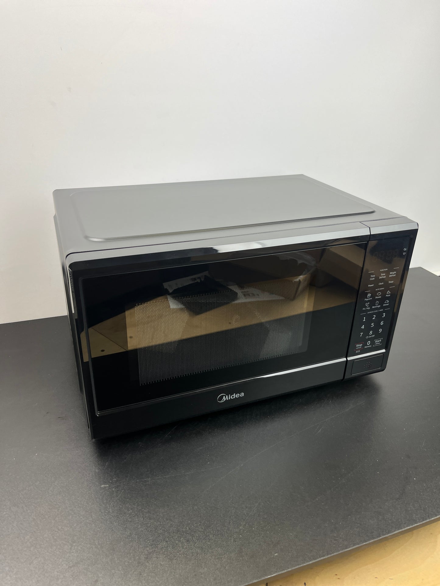 NEW - Midea 0.9 cu. ft. Countertop Microwave Oven - Retail $79
