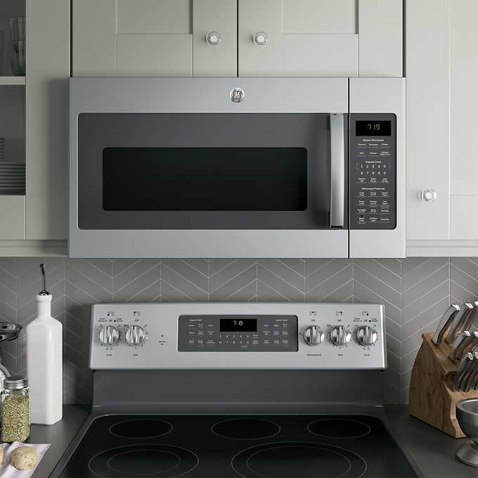 NEW W/ DAMAGE - GE 1.9 cu. ft. Over-the-Range Sensor Microwave Oven with Easy Clean Interior - Retail $439