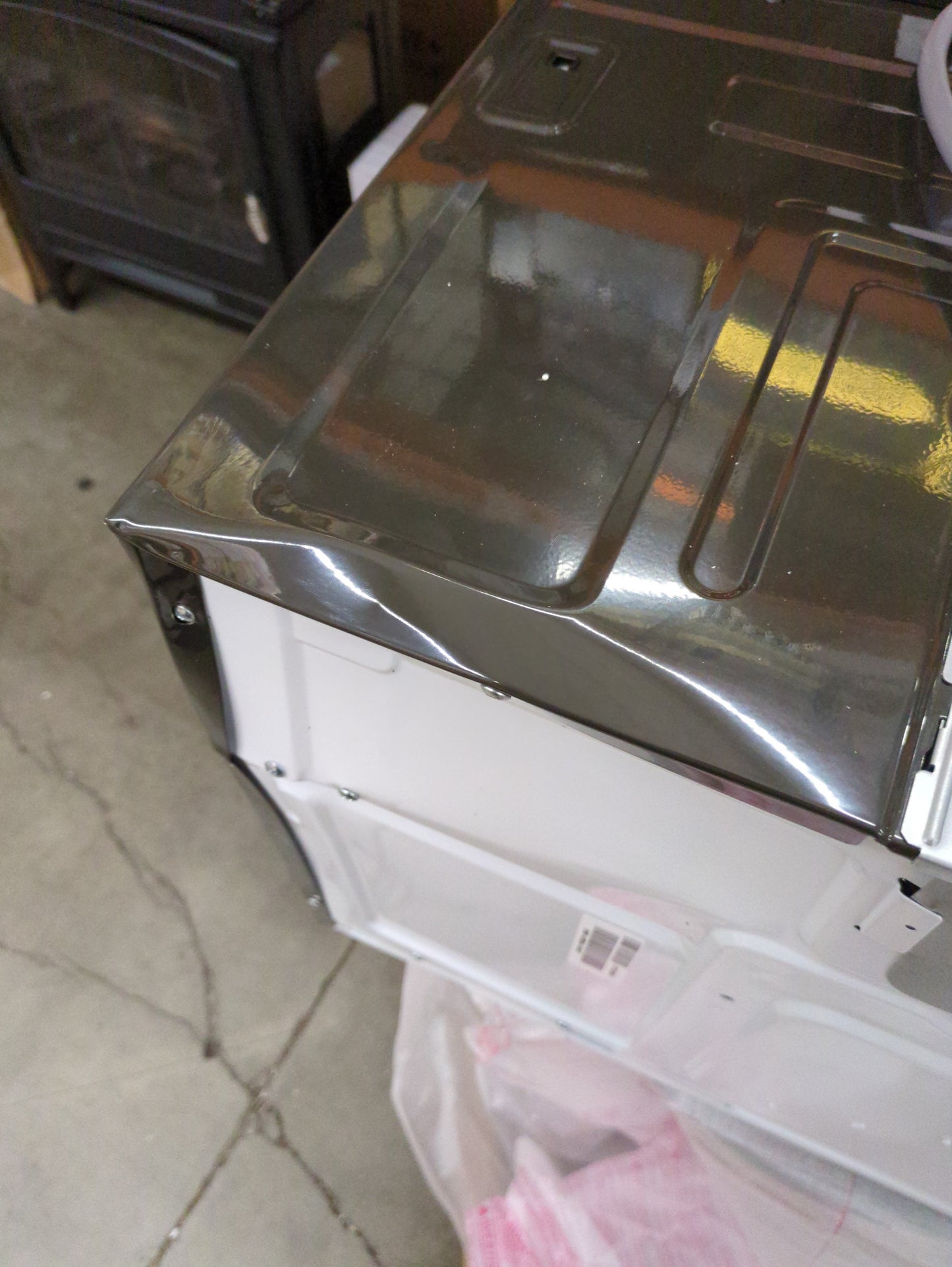 NEW W/ DAMAGE - GE 1.9 cu. ft. Over-the-Range Sensor Microwave Oven with Easy Clean Interior - Retail $439